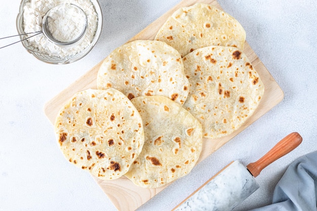 Free Photo homemade wheat tortillas pita bread tortilla pita with ingredients for cooking on a white table top view