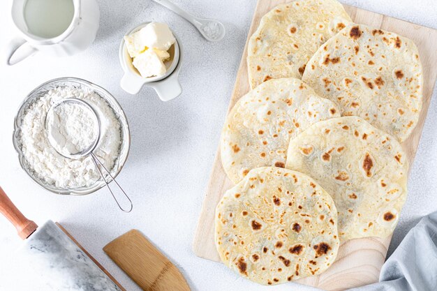 Free Photo homemade wheat tortillas pita bread tortilla pita with ingredients for cooking on a white table top view