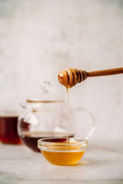 Honey and honey stick with blurred background