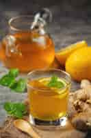 Free photo honey lemon ginger juice food and beverage products from ginger extract food nutrition concept.