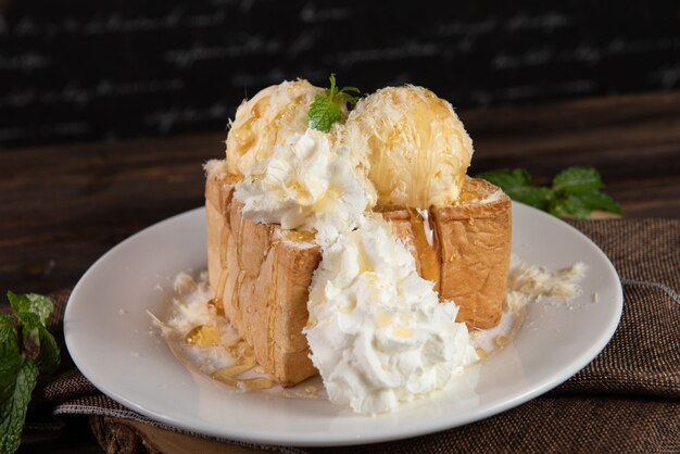 Honey toast with whipped cream and vanilla ice cream