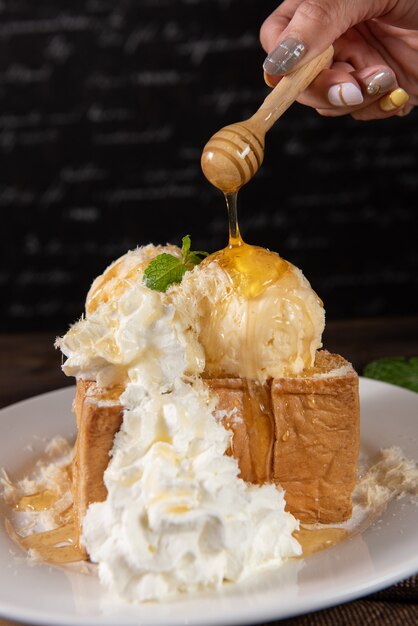 Honey toast with whipped cream and vanilla ice cream