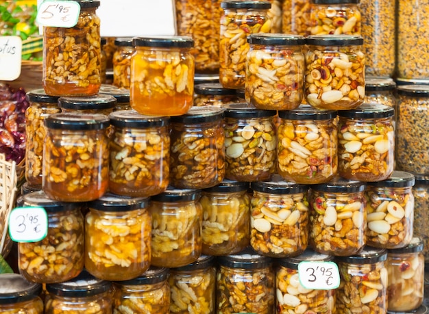 honey with nuts in glass cans