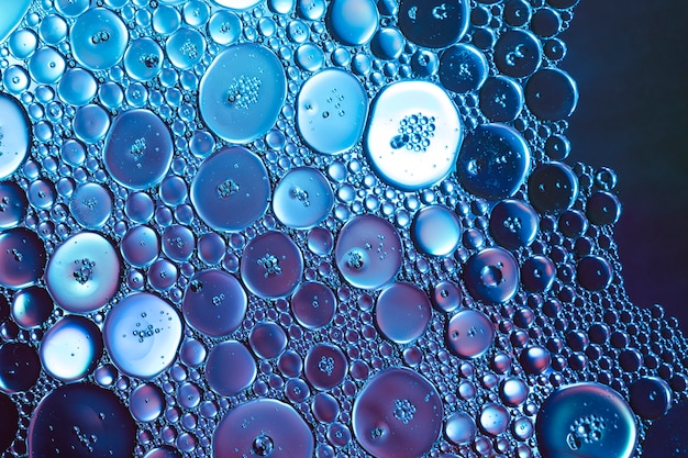 Honeycomb oil drops on blue hue