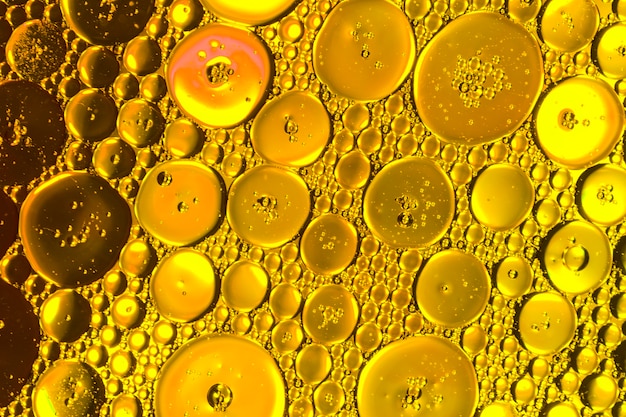 Free photo honeycomb oil drops on golden hue