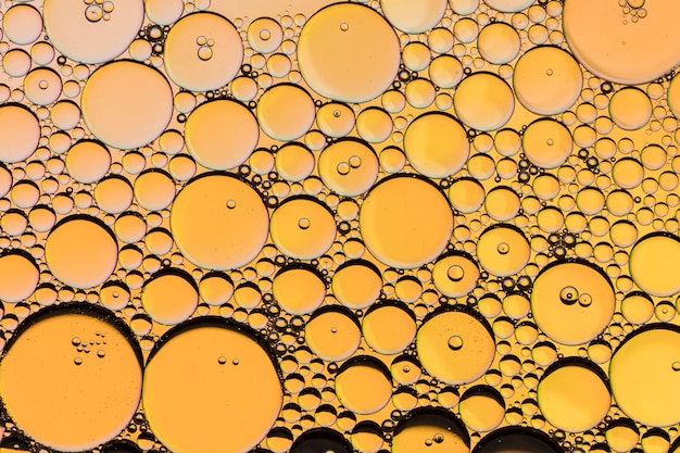 Honeycomb oil drops on yellow