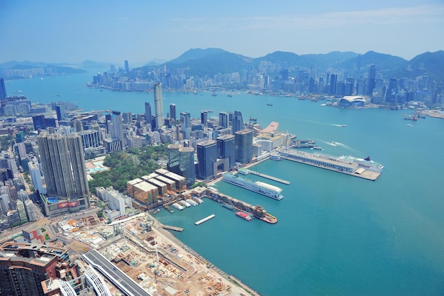 Free photo hong kong aerial view panorama with urban skyscrapers boat and sea.