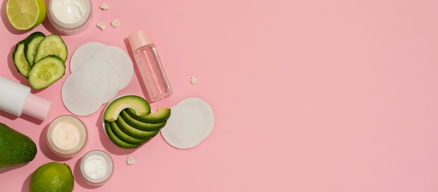 Horizontal banner for cosmetic products with cucumber and avocado