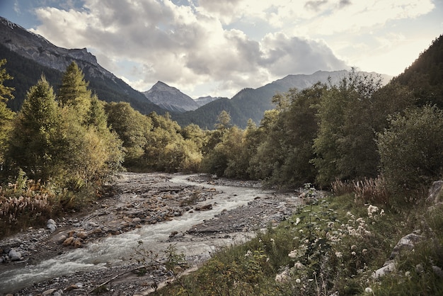 Horizontal shot of brook of St. Maria Val Müstair, Engadin, Switzerland under the cloudy sky