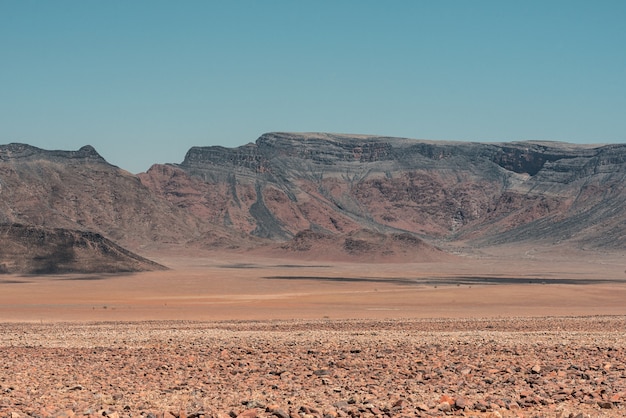 Free photo horizontal shot of mountain landscape at the namib desert in namibia under the blue sky