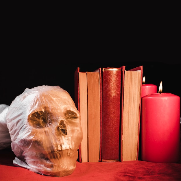 Free photo horror concept with skull and tomes