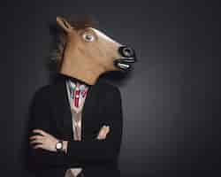 Free photo horse mask man in studio