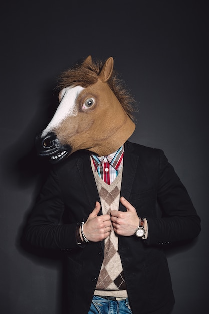 Free photo horse mask man in studio