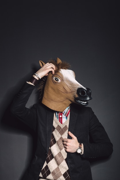 Free Photo horse mask man in studio