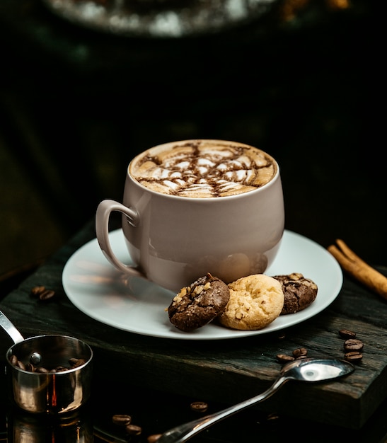 hot chocolate served with cookies