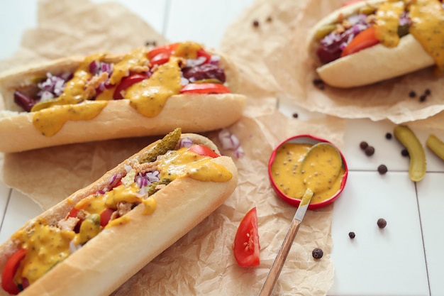 Free photo hot dog with sauce on white surface