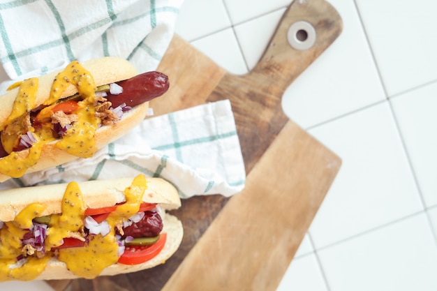 Free photo hot dog with sauce on white surface