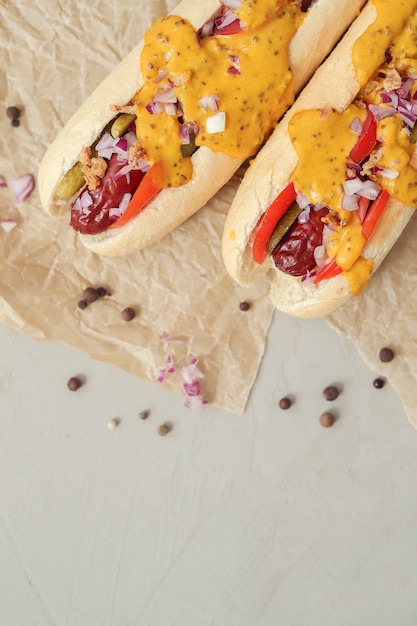 Free Photo hot dog with sauce on white surface