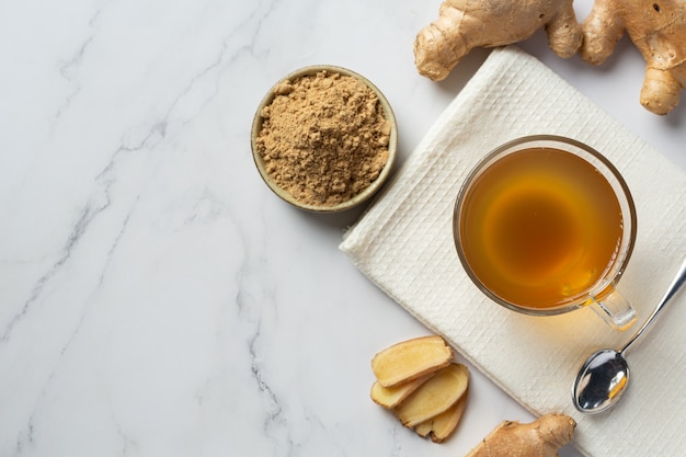 Hot ginger tea on table