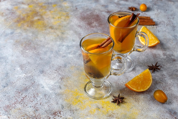 Hot healthy warming winter tea with orange, honey and cinnamon.