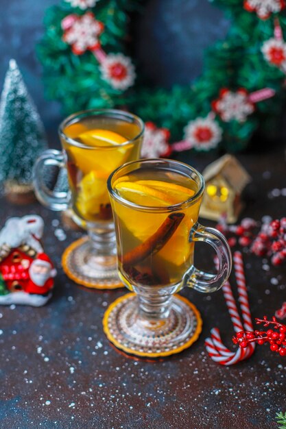 Hot healthy warming winter tea with orange, honey and cinnamon.