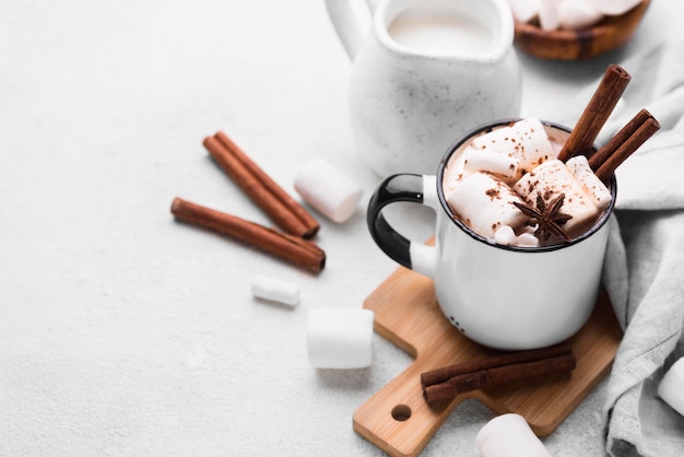 Hot marshmallow drink on wooden board