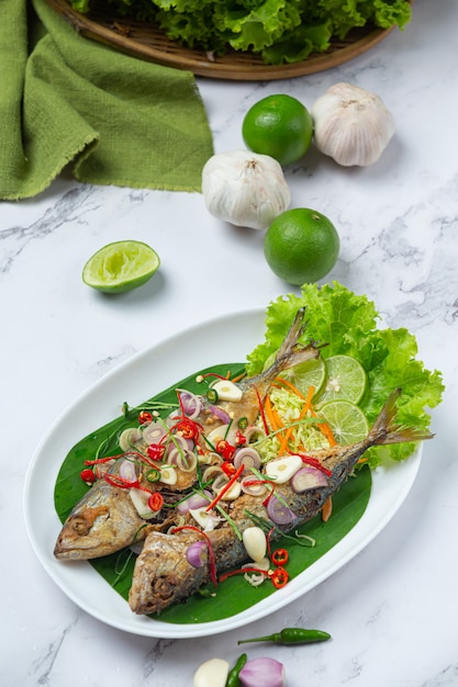 Hot and Spicy Mackerel Decorated with Thai food ingredients