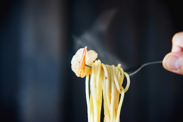 Free photo hot and spicy spaghetti with shrimp and fork