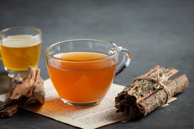 Hot tea and bark on table