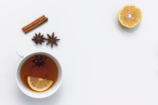 Free photo hot tea cup with various ingredients