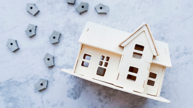 Free photo house model with many small bird houses on concrete background