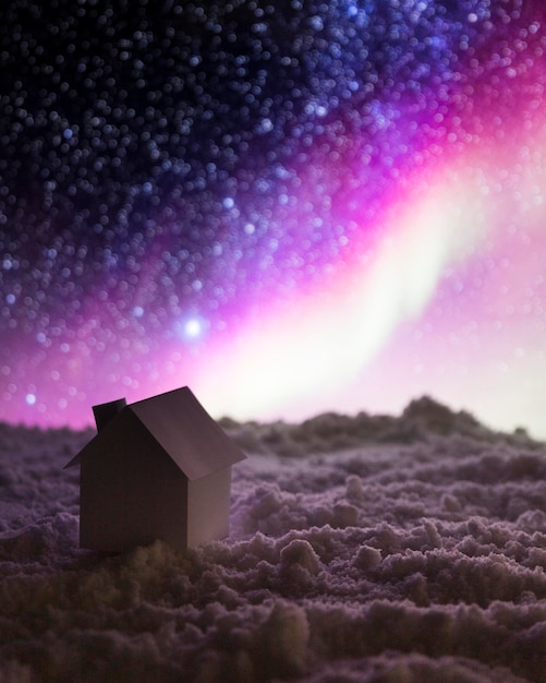 Free Photo house on snow with aurora borealis