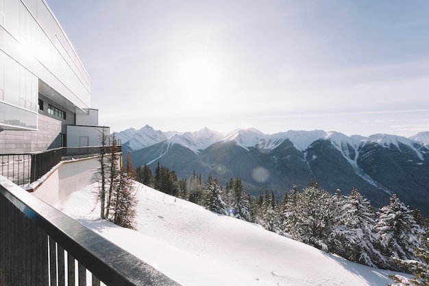 Free photo house in snowy mountains