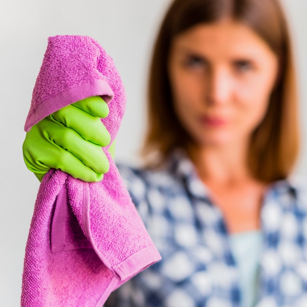 Free Photo housekeeper holding a rag