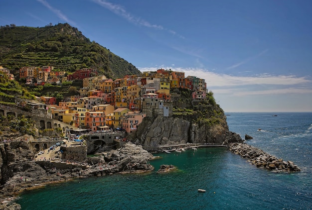 Houses on hill near body of water