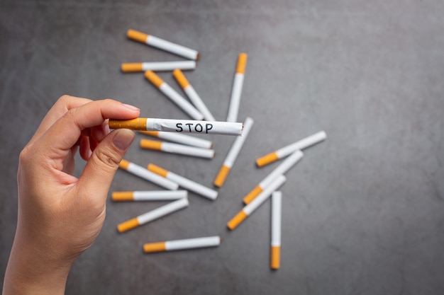 Human hand holding cigarette.World no Tobacco day concept.