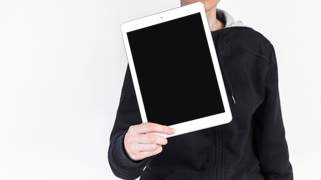 Human hand with digital tablet showing blank black screen