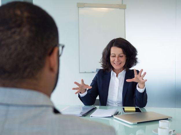 Human resource manager interviewing male applicant