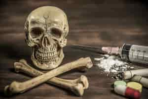 Free photo human skull and crossbones drug addict concept