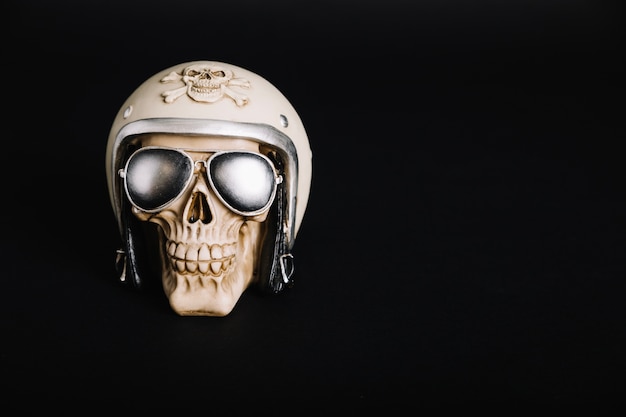 Free Photo human skull wearing helmet and sunglasses