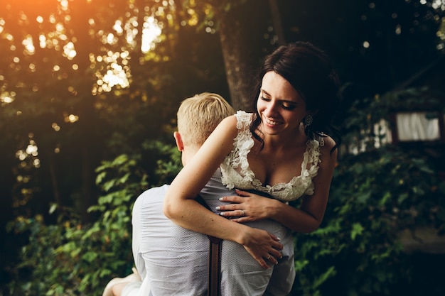 Husband load her wife in sunset