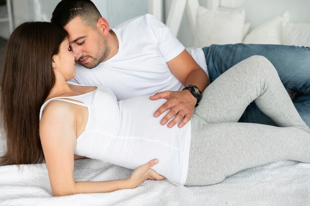 Husband and pregnant wife spending time together alone