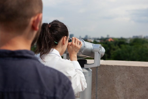 Husband surprising wife with romantic panoramic view of metropolitan city