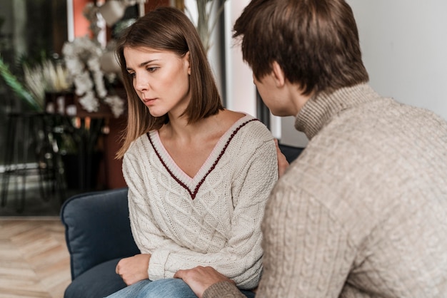 Husband trying to talk to his worried wife