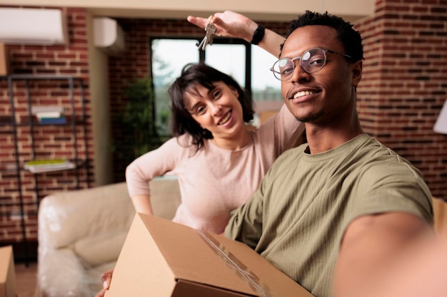 Free photo husband and wife buying new apartment and having house keys, celebrate relationship event being property homeowners. moving in real estate flat together, bought on mortgage loan.