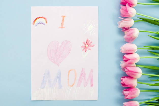 Free photo i love mom drawing on paper with tulips