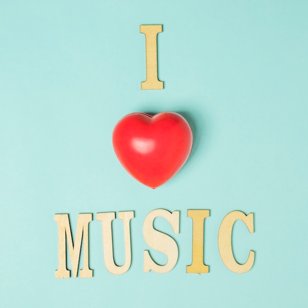 Free photo i love music text with red heart on colored background