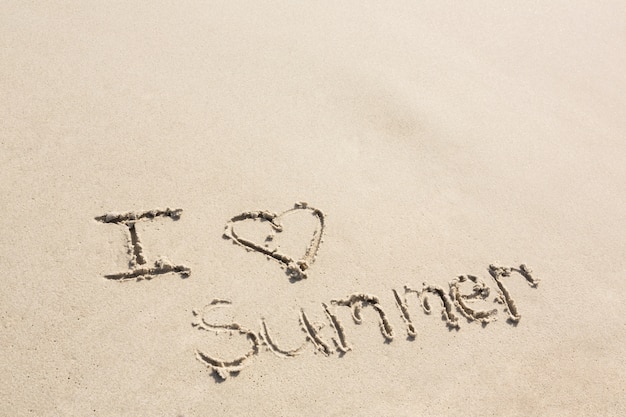 I love summer written on sand