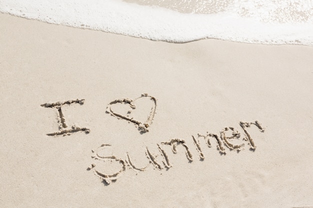 I love summer written on sand