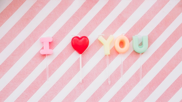 Free Photo i love you inscription of lollipops on wands